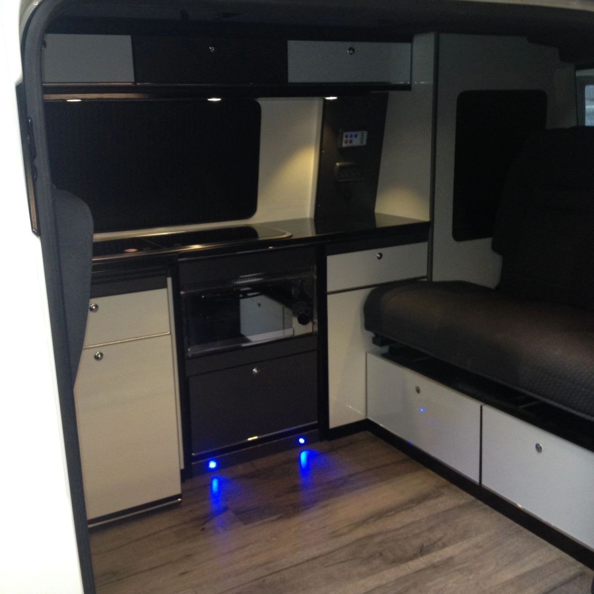 White and black interior with blue floor lighting