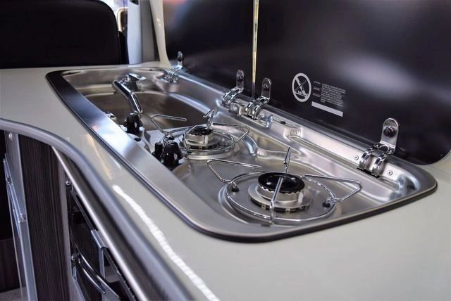 Combined stainless steel sink and two-burner gas hob